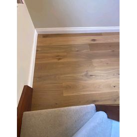 wood flooring meeting carpet
