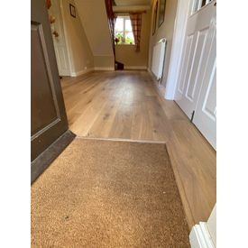 engineered wood fitted to entrance with coir matting