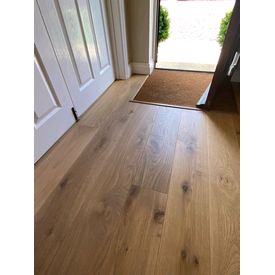 hallway with wood flooring and coir matting