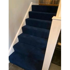 dark blue heavy domestic carpet on stairs
