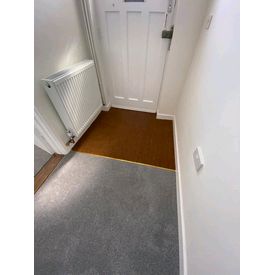 Coir mat and well fitted in hallway